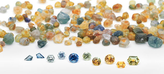 Figure 19. Montana sapphires in a range of shapes and colors. All are heated, and the faceted stones range from about 0.20 ct for the 3 × 5 mm kite shapes on the left to 2.11 ct for the hexagon on the right. Photo by Dillon Sprague; courtesy of Columbia Gem House.