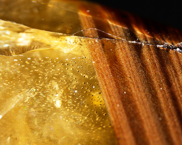 Inclusions and features of the star sapphire’s yellow core.