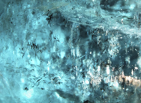 Light is reflected by the copper inclusions.