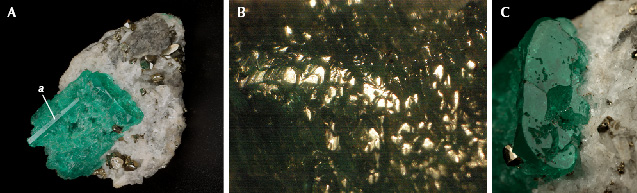 Figure 6. A: Sample 3 (23.6 mm in length), a heavily corroded emerald crystal with a completely dissolved surface related to the <em>m</em> prism face, but with a small protruding area related to the <em>a</em> prism that is almost free of corrosion. B: Only small areas of the original surface of the <em>m</em> prism are still reflective. C: The <em>c</em> basal pinacoid reveals irregularly shaped holes leading to cavities below this face. Photos by G. Martayan (A and C), and K. Schmetzer (B); field of view 7.6 mm (B).