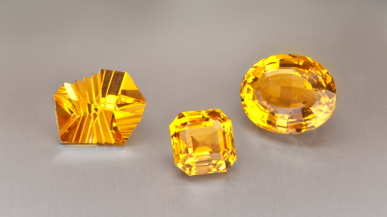A jeweler’s display shows off citrine’s glowing shades with a  designer-cut beauty alongside more traditional emerald-cut and oval gems.