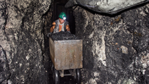 Pushing carts of ore through the tunnels at Los Españoles Pushing carts of ore through the tunnels at Los Españoles