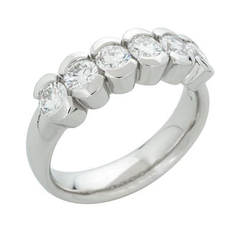 Perspective view of a substantial platinum ring with six matching partial-bezel set stones