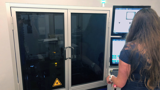 Metrology Technician Nicole Phelan operates fancy melee diamond screening device.