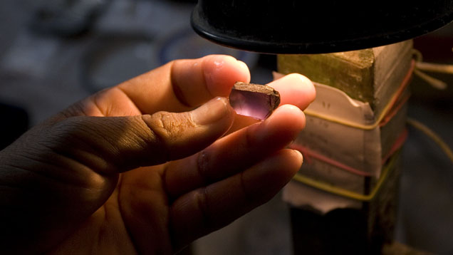 Once faceted, this stone will show a mostly purplish color. The preform stage is where the decision is made between higher weight yield and finer color.