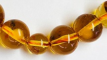 Amber rosary beads clearly show epoxy resin.