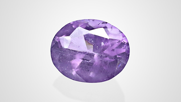 Figure 1. This faceted purple spinel, weighing 0.51 ct and measuring 5.20 × 4.17 × 3.10 mm, was reportedly from Tanzania. Photo by Jinlin Wu. Figure 1. This faceted purple spinel, weighing 0.51 ct and measuring 5.20 × 4.17 × 3.10 mm, was reportedly from Tanzania. Photo by Jinlin Wu.