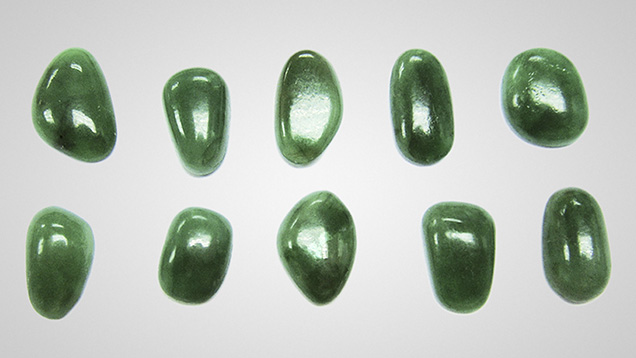 In recent years, the coating of low-quality jadeite has reemerged in the Chinese markets. These coated jadeites (1.43– 2.71 ct) were examined in the study. Photo by Jian Zhang.