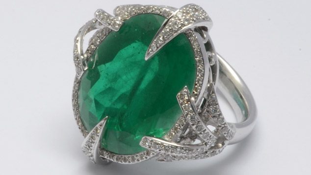 Beryl and topaz doublet resembling emerald