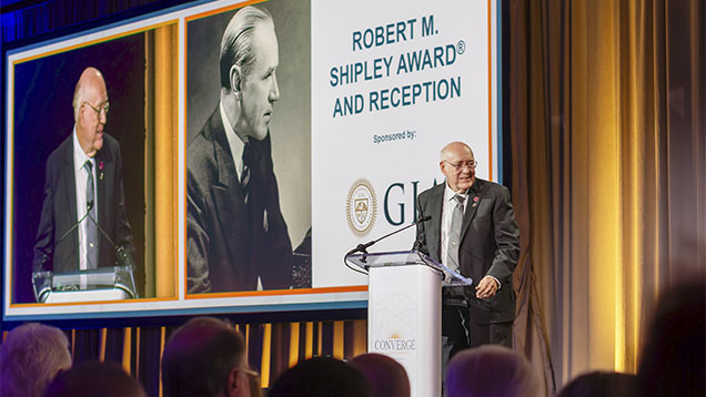 Al Gilbertson accepts the Robert M. Shipley Award at Converge in Carlsbad, California. Photo by Russel Samson.