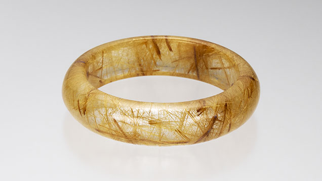 Figure 8. Brazilian rutilated quartz bangle (6.5 inches in circumference). Photo by Mimi Travis; courtesy of Tao Hsu.