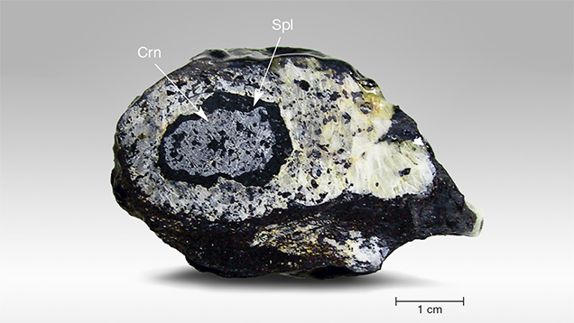 Gray Corundum Coated by Black Spinel Layer