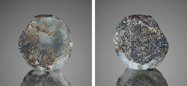 Figure 16. This 5.23 ct, 13.7 mm French Bar sill sapphire (RK-FBS 041) still shows the rarely occurring triangular pattern on the basal plane, among significant resorption that occurred during the magmatic transport to the surface (left). The other side of the same crystal shows much adhering biotite (phlogopite), as well as other mineralization (right). Photos by Jeff Mason.