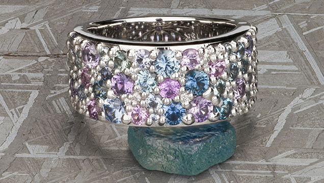 Figure 14. This “Twilight” ring showcases some of the common range of colors seen in Montana sapphire. The sapphires are unheated, with 3.80 total carat weight. Photo courtesy of Earth’s Treasury.