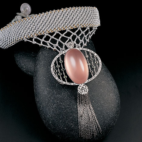 Knotted necklace with rose quartz pendant