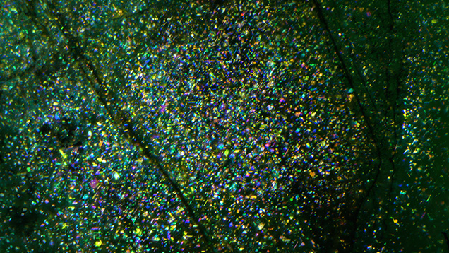 Minute fluid inclusions create asterism in emerald.