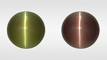 Alexandrite cabochon in fluorescent (left) and incandescent light (right).