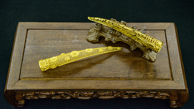 24K gold replica of Quing dynasty fingernail protector