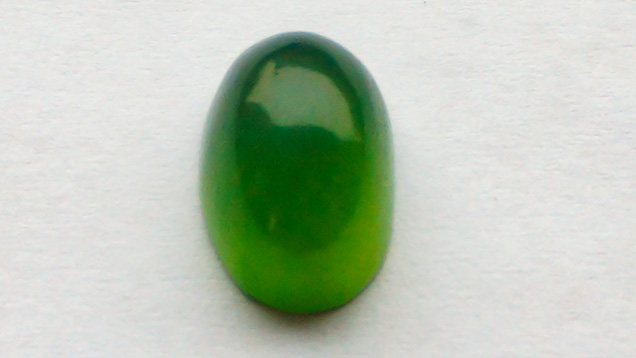 Olive-green serpentine cabochon.