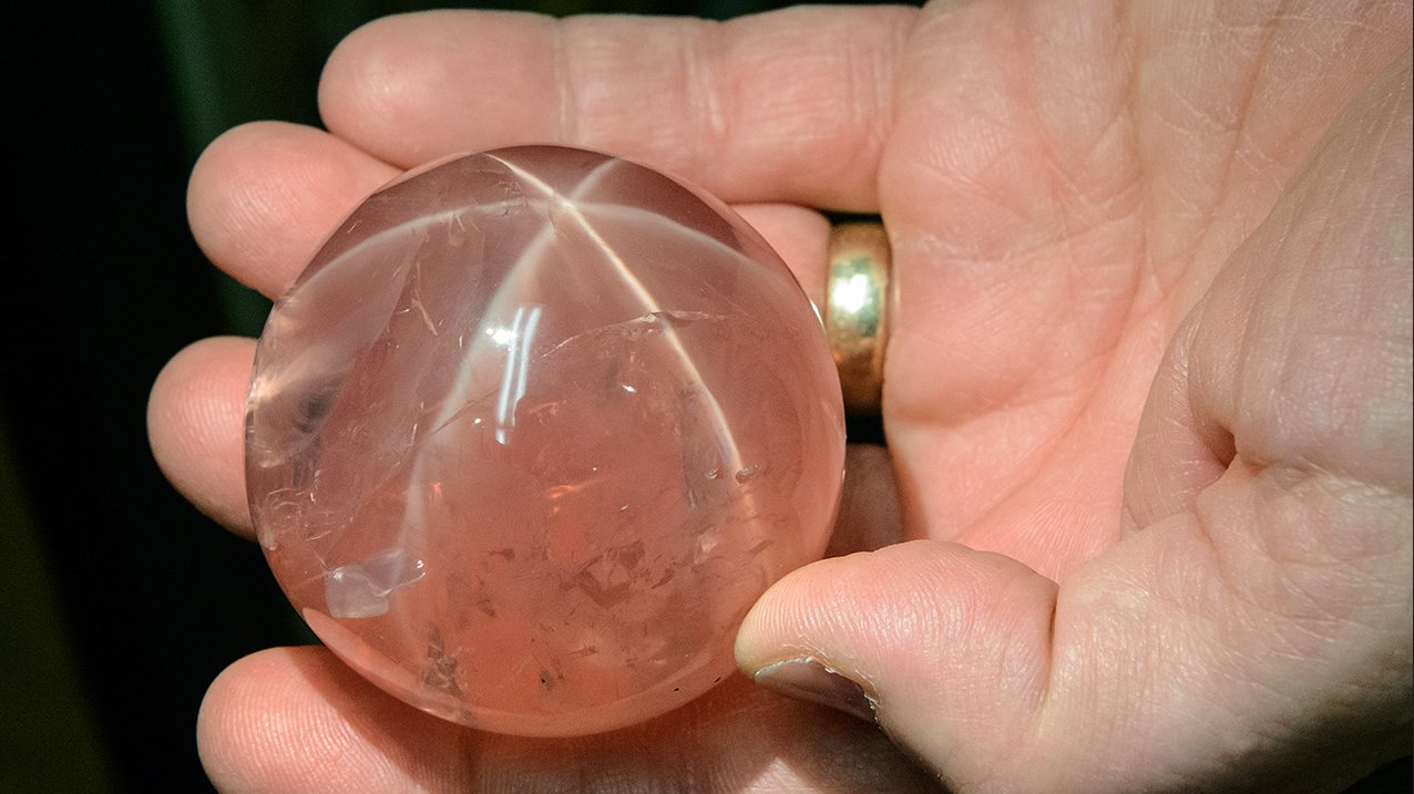 The impressive size of this museum-quality star rose quartz can be seen by comparing it to the hand that holds it. It’s part of the gem collection at the Smithsonian Institution in Washington, DC. – Eric Welch