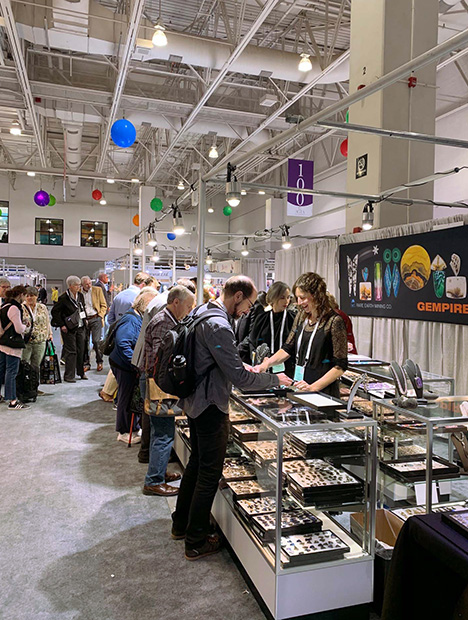Crowded booth at AGTA gem show.