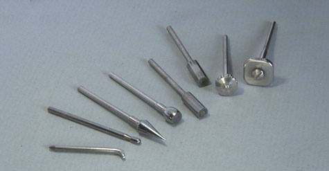 This one features a highly polished stainless steel tip with a curved, smooth surface. For ease of use, it’s mounted in a wooden handle. This tool is useful for burnishing light scratches in platinum ring shanks.