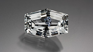 Brazilian colorless topaz with molybdenite inclusions.