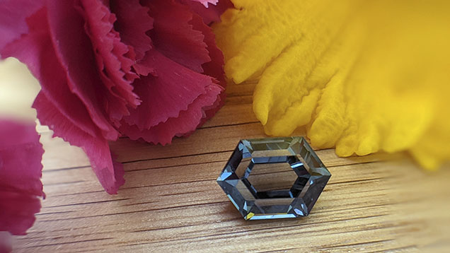 Figure 18. With their nonstandard colors, Montana sapphires have become popular for cutters experimenting with nontraditional cutting techniques. This 4.17 ct unheated sapphire cut by Nadine Marshall was sourced from the Missouri River. Courtesy of Obsessed Over Gems.