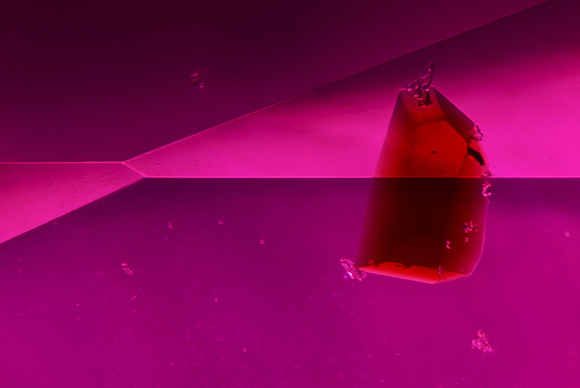 Brownish red staurolite crystal in ruby host.