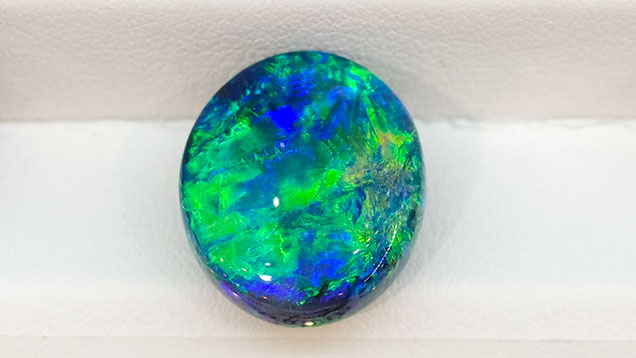 Black opal cabochon from Lightning Ridge