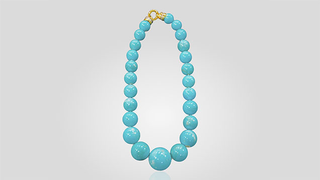 Figure 20. A Mona Lisa turquoise necklace with a matched suite of stabilized beads (diameter of largest bead is 35 mm). Photo by Thomas Paradise.