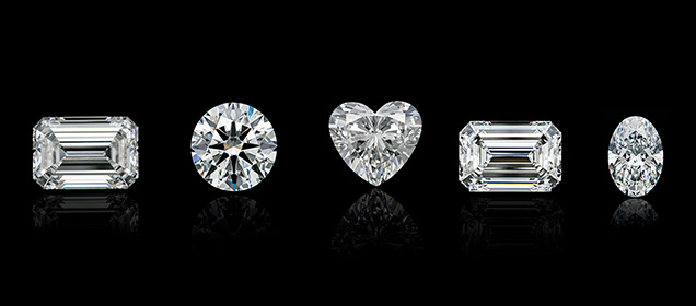 Figure 18. Large laboratory-grown diamonds such as these CVD-grown diamonds have become increasingly common the last few years. From left: a 12.06 ct G-color, VS<sub>2</sub> emerald cut; an 11.36 ct E-color, SI<sub>1</sub> round brilliant; a 10.42 ct G-color, VS<sub>2</sub> heart brilliant; a 10.19 ct F-color, VS<sub>2</sub> emerald cut; and a 9.52 ct E-color, VS<sub>2</sub> oval brilliant. Photos by Gaurav Bera.