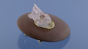 这件妙趣横生的作品叫做“清寂空灵”(Emptiness in a Circle)，灵感来自 Shel Silverstein（谢尔·希尔弗斯坦）的儿童读物《失落的一角》，由木头、蔷薇石英、帝王托帕石和 18K 黄金精心打造。 它既可作为吊坠又可作为胸针佩戴。 - 图片来源：Don Mengason，© 美国宝石研究院（由 Maria Lucia Barbosa 捐赠）。