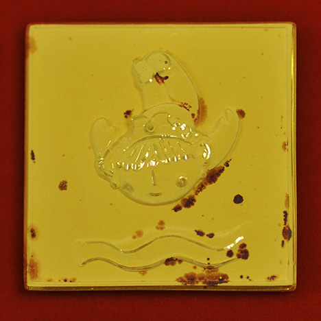 Tarnish spots on an Olympic commemorative pin