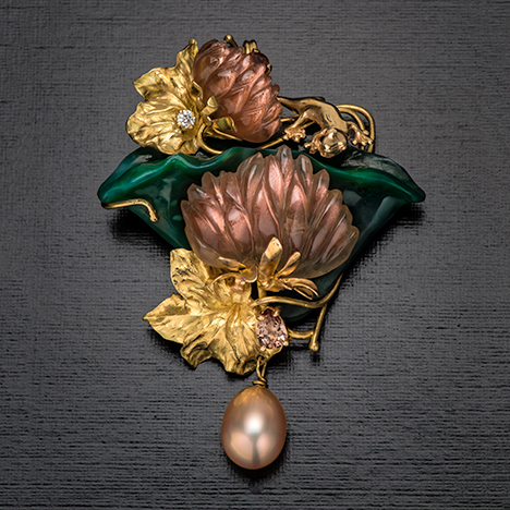 Pin/pendant with sunstone, pearl, diamond, chalcedony, and zircon.