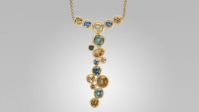 Figure 13. Faceted unheated Montana sapphires set in 18K gold. Photo by Orasa Weldon; courtesy of Diana Widman.