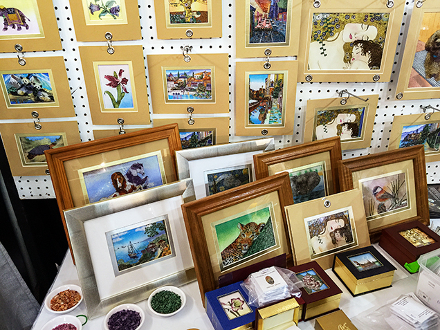 Assortment of gem paintings.