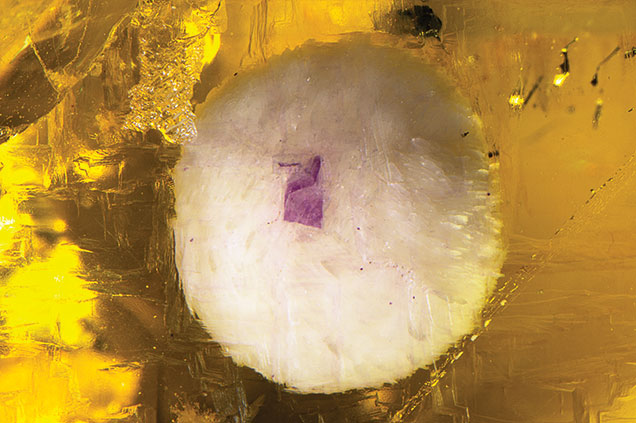 Purple spot in barite inclusion.