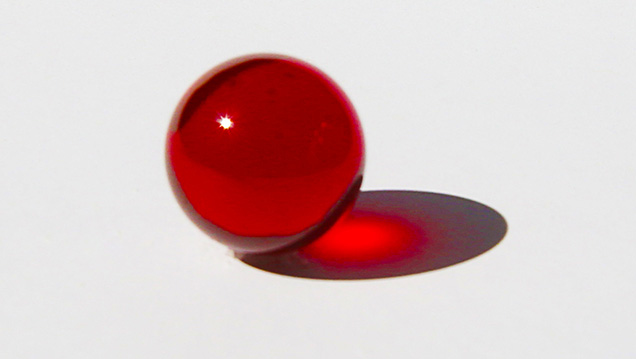Transparent synthetic ruby sphere