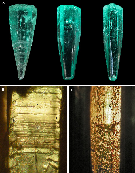 Figure 8. A: Emerald crystals with pyramidal or partly pyramidal habit: sample 5 (left, 10.0 mm in length), sample 7 (center, 8.8 mm in length), and sample 6 (right, 8.8 mm in length). B: Surface texture of the pyramidal emerald crystal (sample 5) showing growth lines related to the basal pinacoid <em>c</em> (center) and pyramidal faces <em>p</em> (left and right). C: Complex surface texture of a partly pyramidal, partly prismatic crystal (sample 7) showing a complex pattern related to pyramidal faces (lower part) and to basal, pyramidal, and prism faces (upper part). The growth direction of the crystals shown in A–C is always from the bottom to the top. Photos by G. Martayan (A) and K. Schmetzer (B and C); fields of view 2.4 mm (B) and 2.4 mm (C).