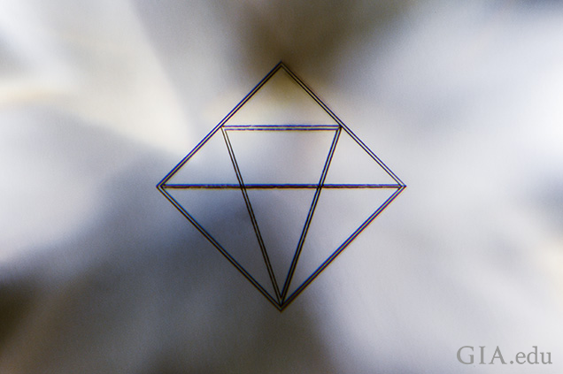 De Beers’ line of CVD laboratory-grown diamonds can be easily recognized by the 300 × 300 micron logo inscribed about 200 microns below the surface of the table facet.