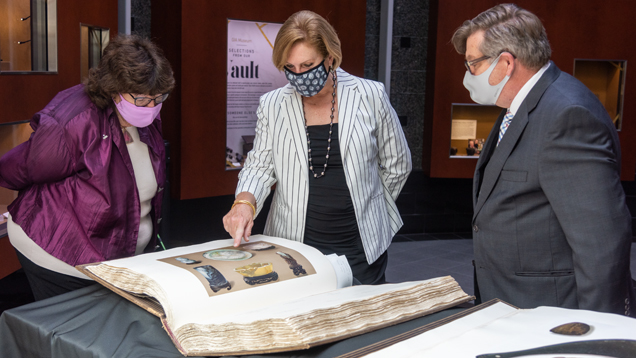 Display of The Bishop Collection: Investigations and Studies in Jade by Heber Reginald Bishop, 1906. Purchased at Skinner’s March 25, 2021 Asian Works of Art auction. Pictured from left: Retired GIA Library Director Dona Dirlam, GIA President and CEO Susan Jacques, current GIA Library Director Robert Weldon. Photo by Emily Lane/GIA.