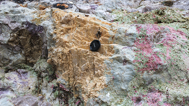 Tourmaline, clevelandite, lepidolite, and “salmon”-colored feldspar at the Havey Quarry.
