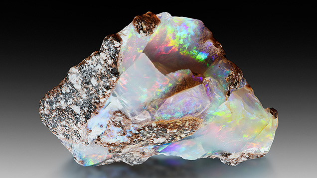 Figure 7. Precious opal in andesite host rock (28 × 22 × 14 mm). Photo by Albert Russ; courtesy of Great Rent JSC.