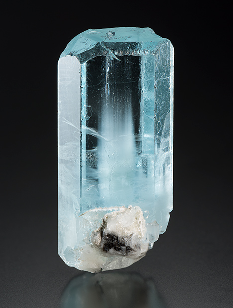 This aquamarine crystal showed iridescence as it is turned under a moving light source.