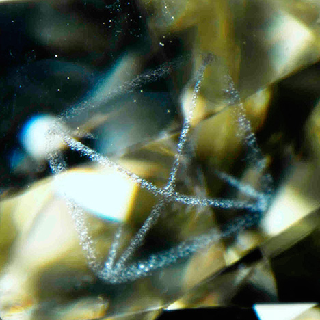 Graphite outlines the octahedral crystal faces.