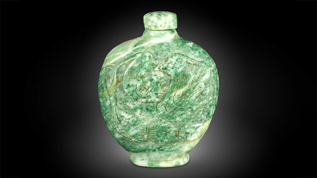 Figure 1. A green snuff bottle (64.7 × 51.3 × 25.9 mm) submitted for identification as jadeite jade. Photo by Shu-Hong Lin.