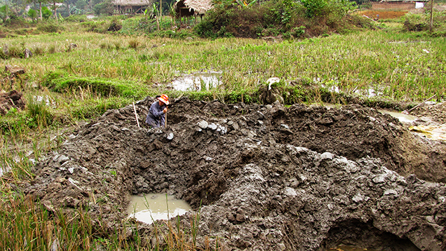 Farmer digging for tourmaline in Luc Yen, Vietnam