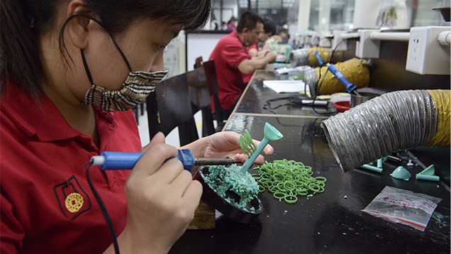 Workers manufacturing wax models in Guangdong province