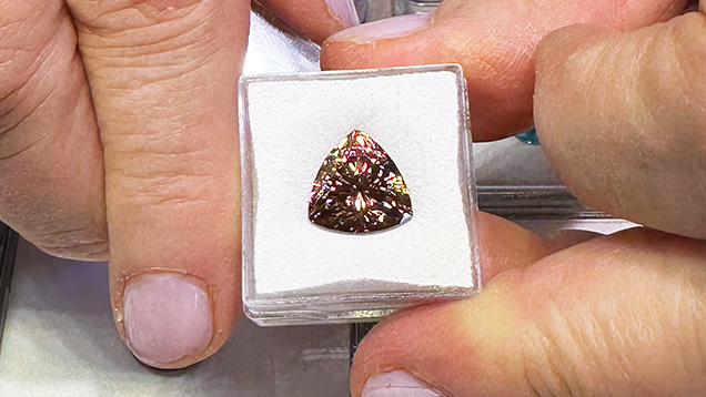 Figure 5. An 11.7 mm, 8.34 ct “mocha” zircon trillion. Photo by Jennifer Stone-Sundberg; courtesy of Mayer & Watt.